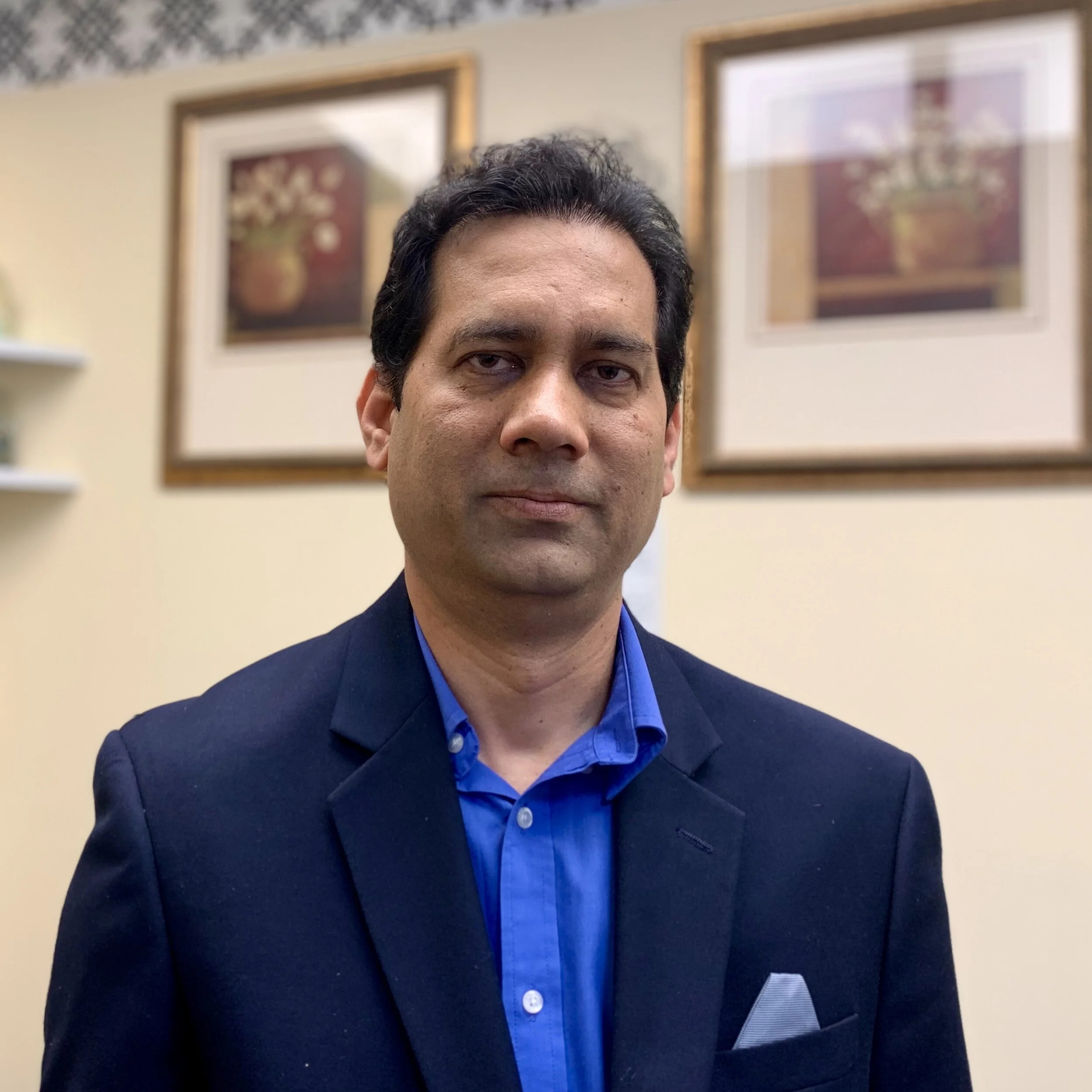 Irfan Khan, President and Principal Accountant at his Jackson Heights, Queens NY office